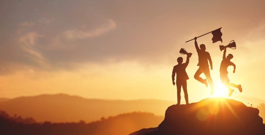 Success,And,Achieving,Goals.,Silhouette,Of,Businessman,Holding,A,Trophy