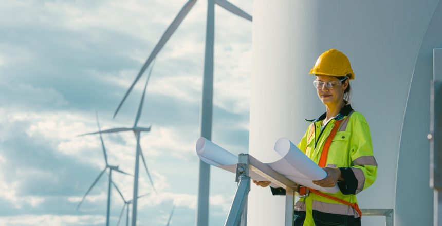 Female,Engineer,Working,Outdoor,With,Safety,At,Wind,Turbines,Clean