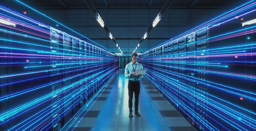 Futuristic,Concept:,Data,Center,Chief,Technology,Officer,Holding,Laptop,,Standing