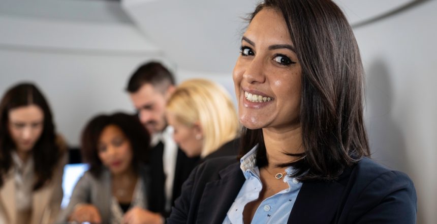 Smiling,Moroccan,Businesswoman,Working,Inside,Modern,Office,With,The,Multiethnic