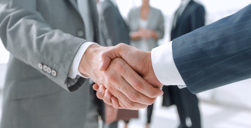 Closeup.reliable,Handshake,Of,Business,Partners