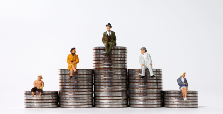 Miniature,People,Sitting,On,Piles,Of,Coins.,The,Concept,Of