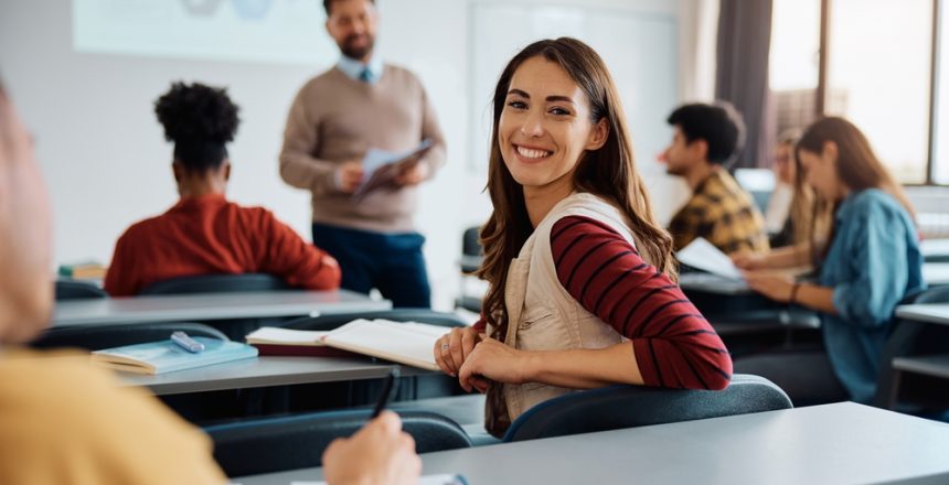 Happy,College,Student,During,A,Lecture,In,The,Classroom,Looking