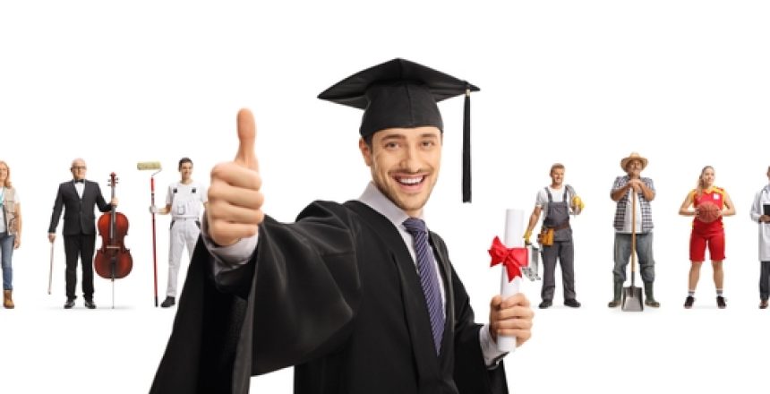 Man,In,A,Graduation,Gown,Gesturing,Thumbs,Up,In,Front